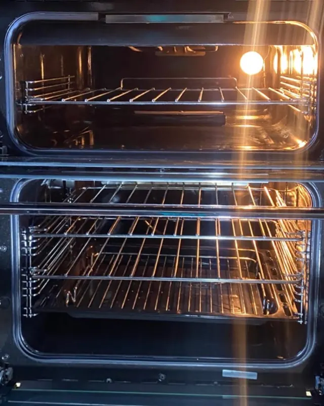 The same double oven after professional cleaning